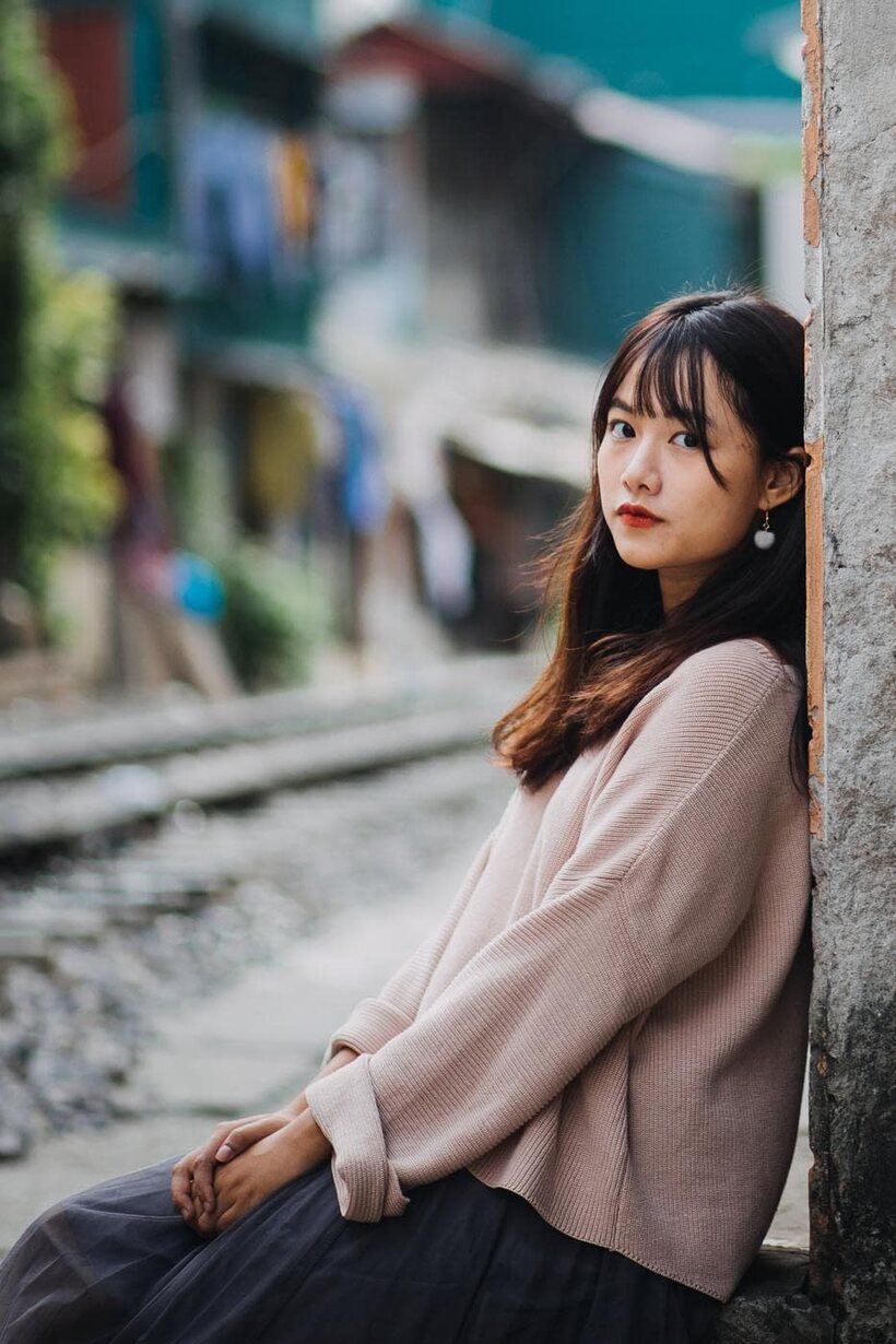 Posing on the railroad, this gorgeous Asian model shows off her outfit (shot 6)