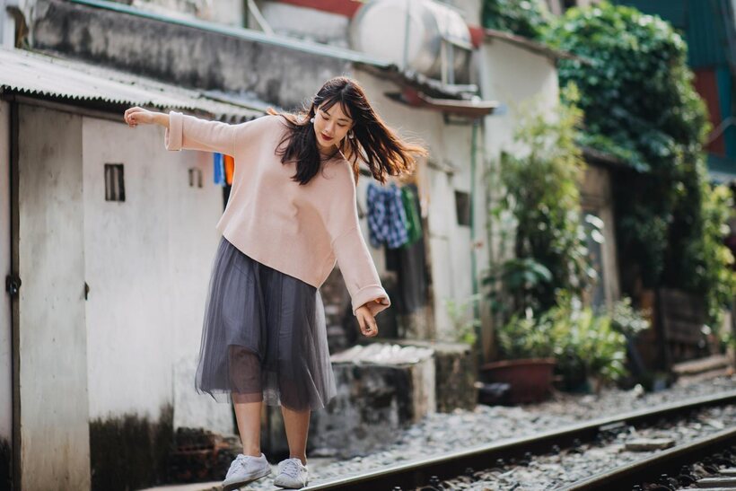 Asian nude photo 7 — Posing on the railroad, this gorgeous Asian model shows off her outfit