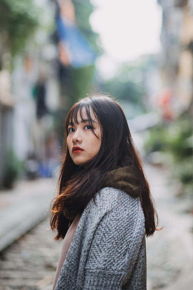 Image 14/21: Posing on the railroad, this gorgeous Asian model shows off her outfit