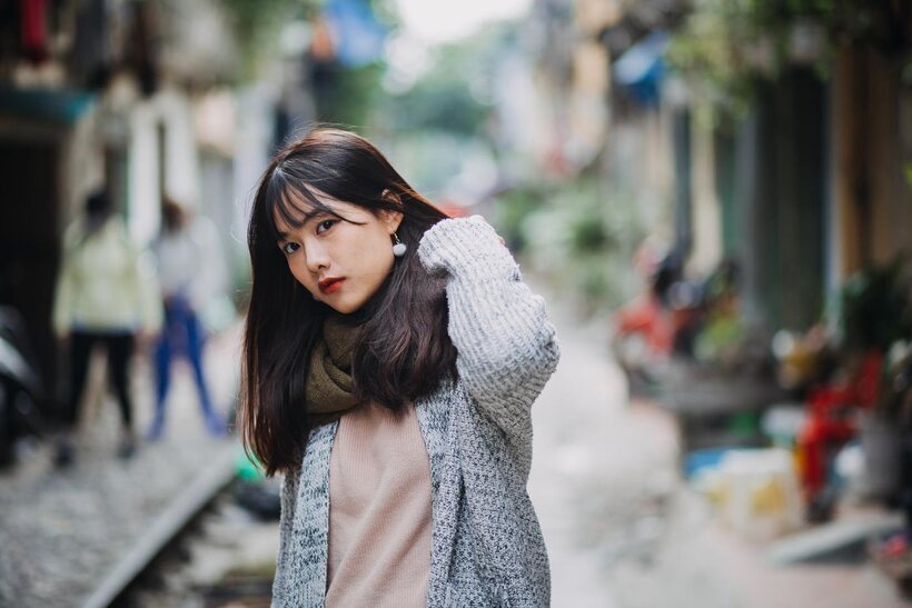 Image 17/21: Posing on the railroad, this gorgeous Asian model shows off her outfit