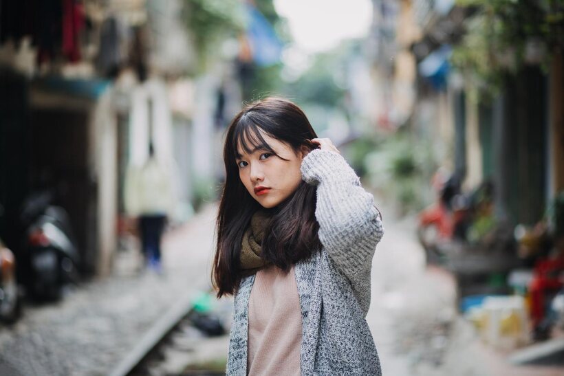 Posing on the railroad, this gorgeous Asian model shows off her outfit (shot 18)