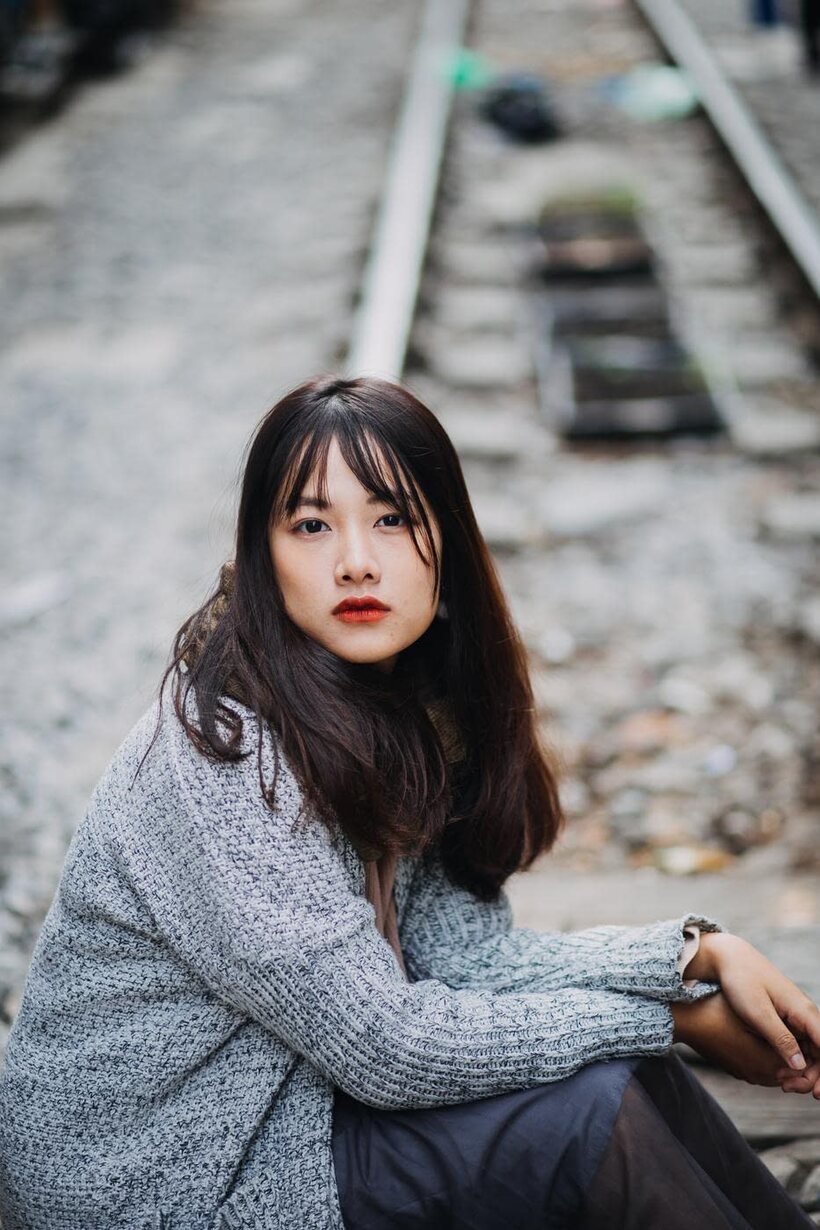 Photo 19 — Posing on the railroad, this gorgeous Asian model shows off her outfit