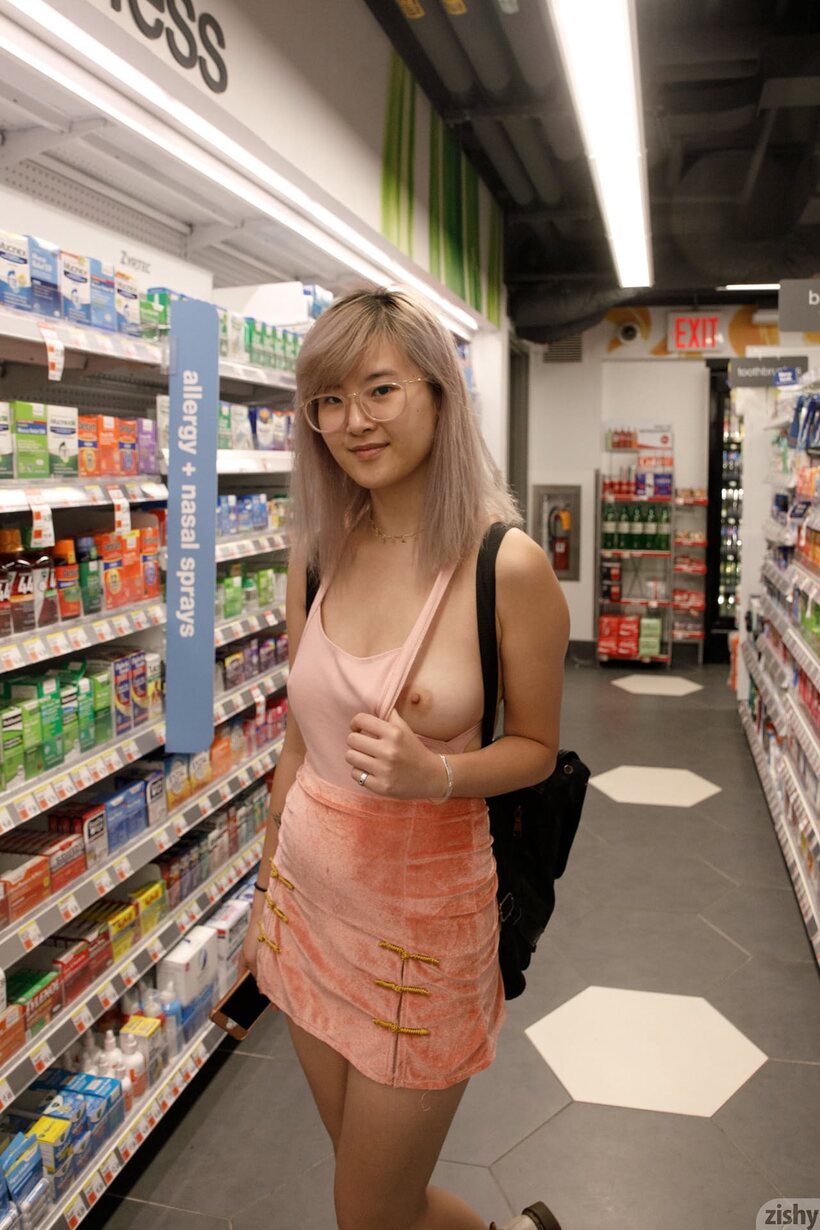 Image 5/12: Petite Barbie Qu strips out of her skirt and starts flashing