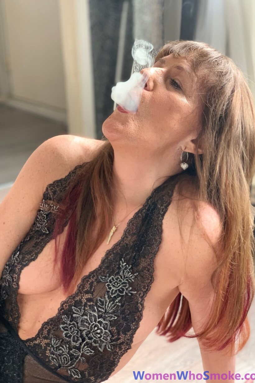 Photo 13 — Pandora Smith smokes a cigarette and poses in lingerie