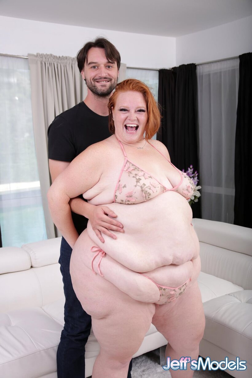 Redhead Julie Ginger exposes her big tits and swollen pussy while sucking cock (shot 9)