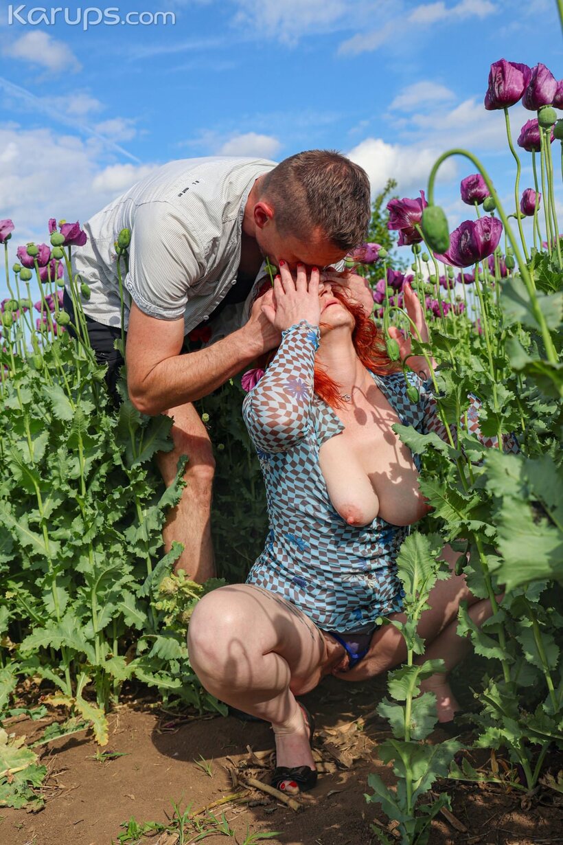 Photo 2 — Sucking and fucking in a field, redheaded amateur shows off big natural tits