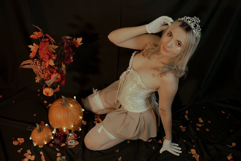 Amateur nude photo 4 — Blonde amateur teases non nude in a Halloween-themed shoot
