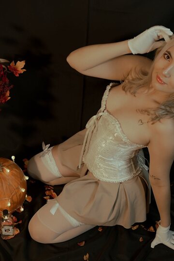 Blonde amateur teases non nude in a Halloween-themed shoot
