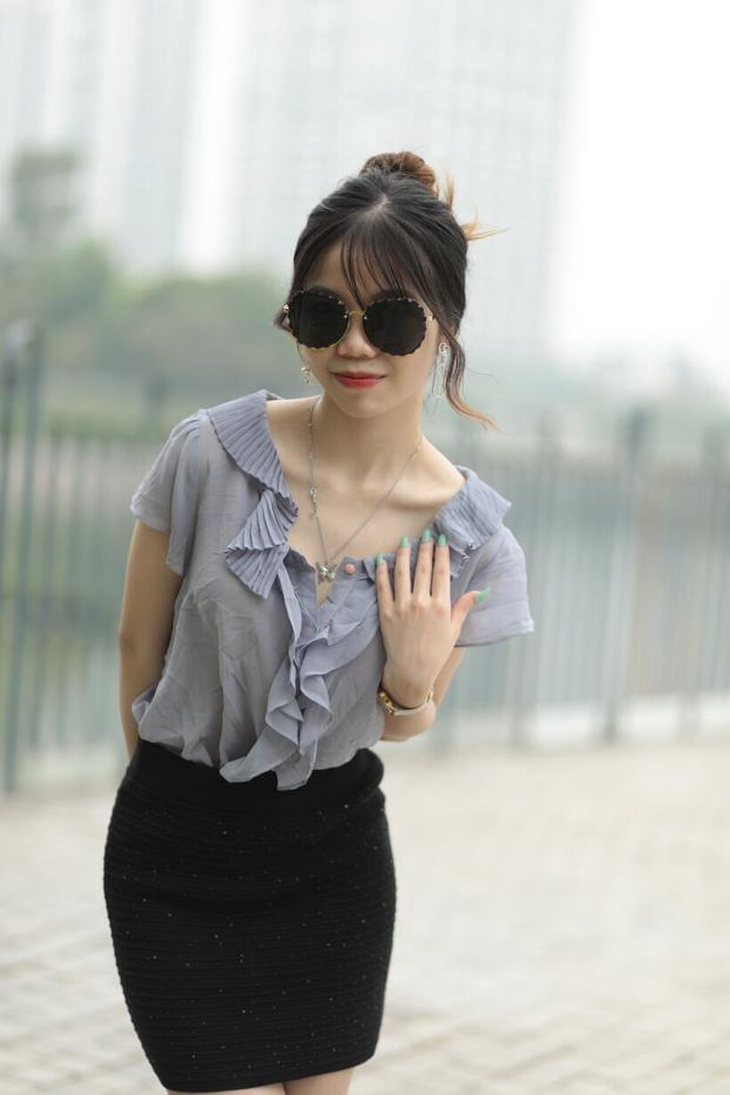 Asian teen teases in non-nude bridge poses wearing shades (shot 3)