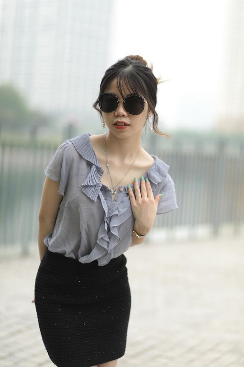 Image 5/21: Asian teen teases in non-nude bridge poses wearing shades