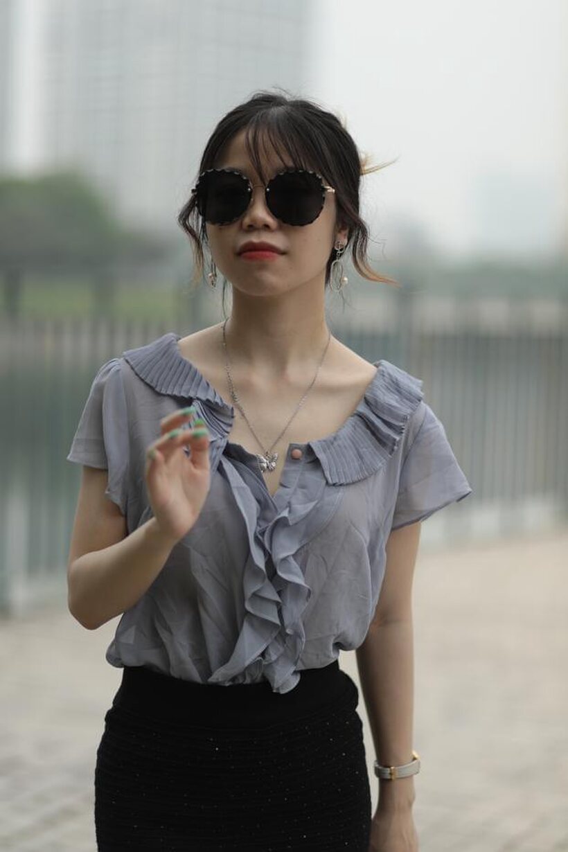 Asian teen teases in non-nude bridge poses wearing shades (shot 10)