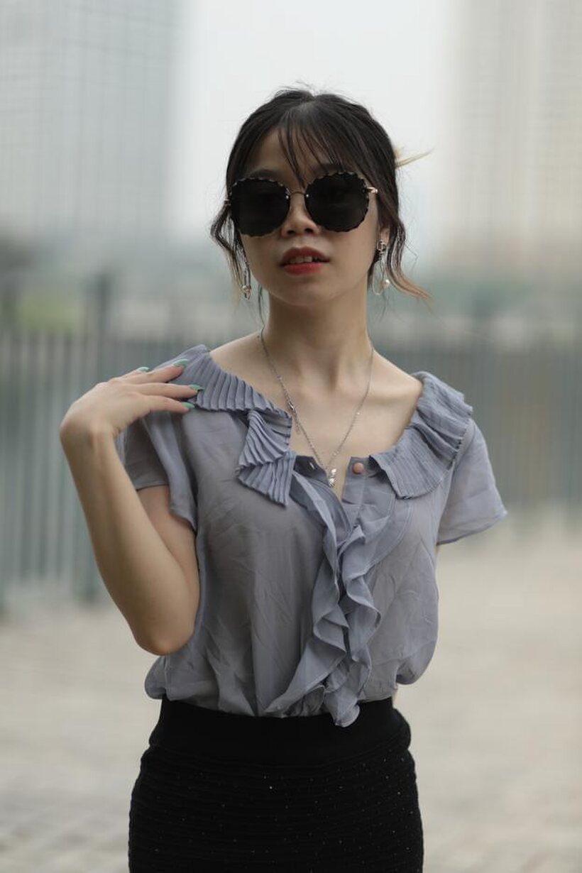 Image 16/21: Asian teen teases in non-nude bridge poses wearing shades