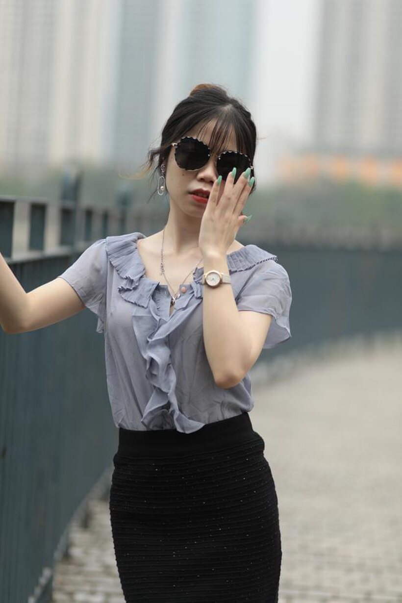 Amateur pic 17 from the set «Asian teen teases in non-nude bridge poses wearing shades»