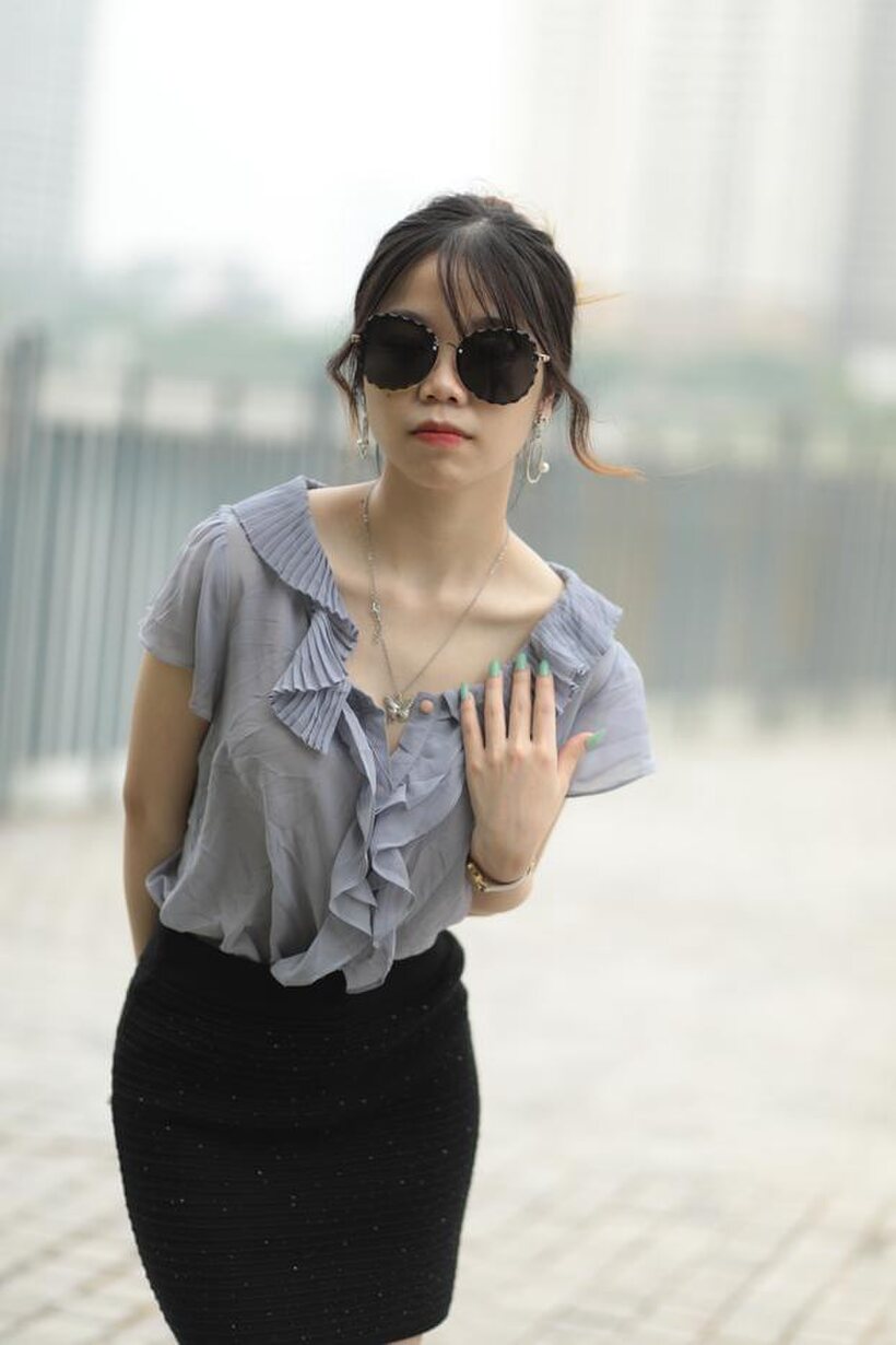 Image 20/21: Asian teen teases in non-nude bridge poses wearing shades
