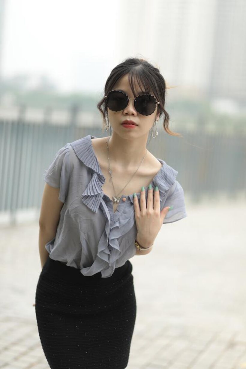 Image 21/21: Asian teen teases in non-nude bridge poses wearing shades