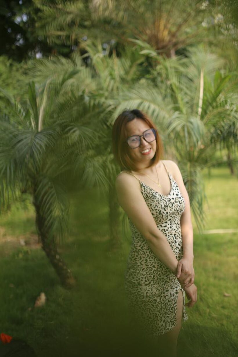 Photo 6 — Eyeglasses and leopard dress frame this sweet Asian babe outdoors