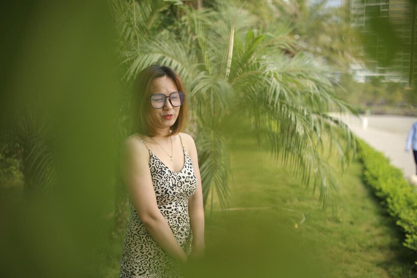 Photo 7 — Eyeglasses and leopard dress frame this sweet Asian babe outdoors