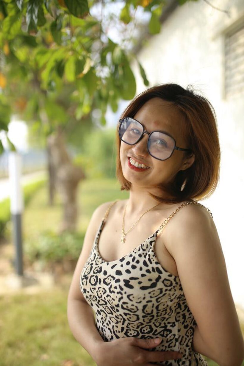 Eyeglasses and leopard dress frame this sweet Asian babe outdoors, photo 15 of 21