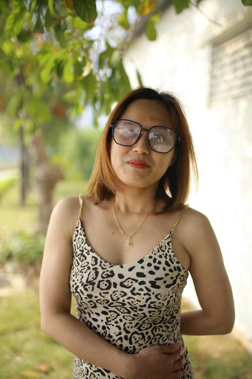 Eyeglasses and leopard dress frame this sweet Asian babe outdoors (shot 18)