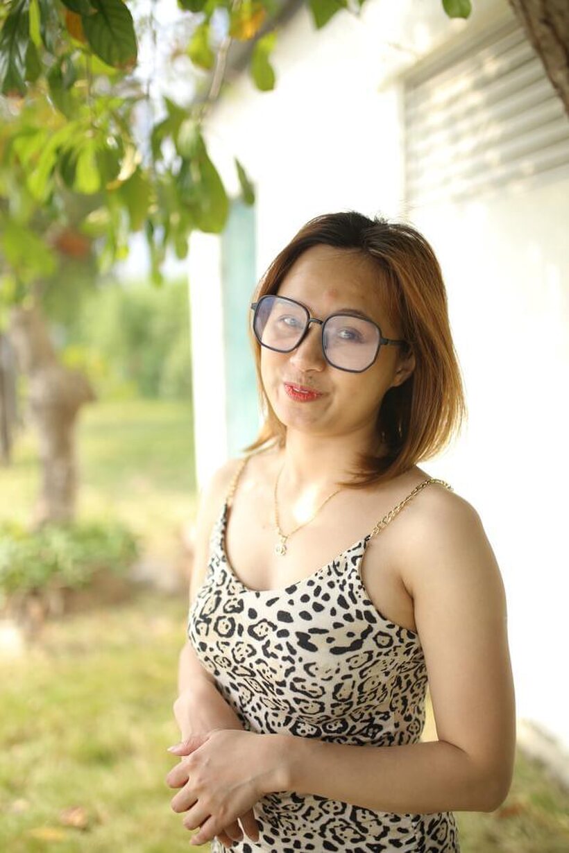 Eyeglasses and leopard dress frame this sweet Asian babe outdoors, photo 20 of 21