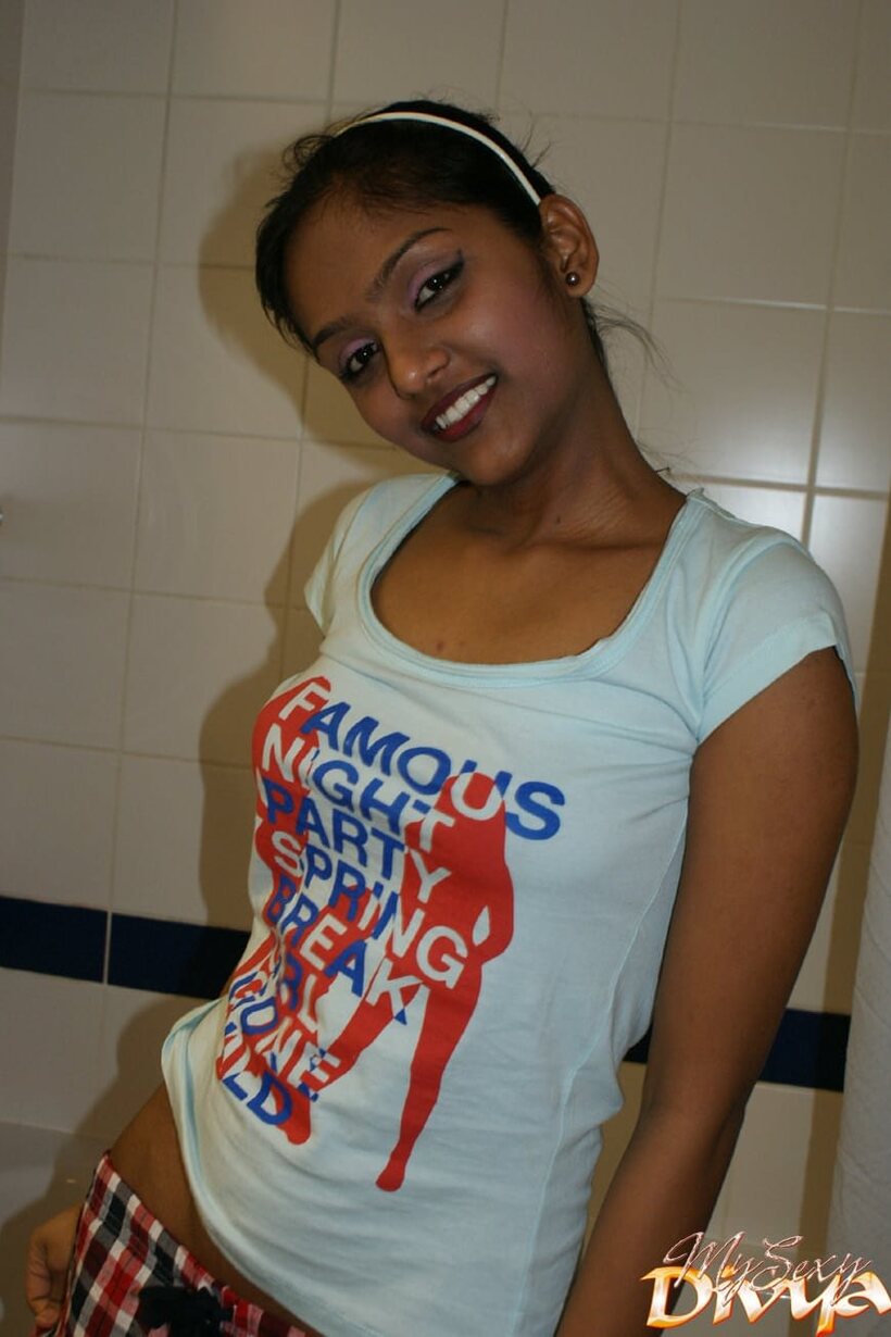 Wet Divya Yogesh flaunts her natural tits and puffy nipples while undressing (shot 1)