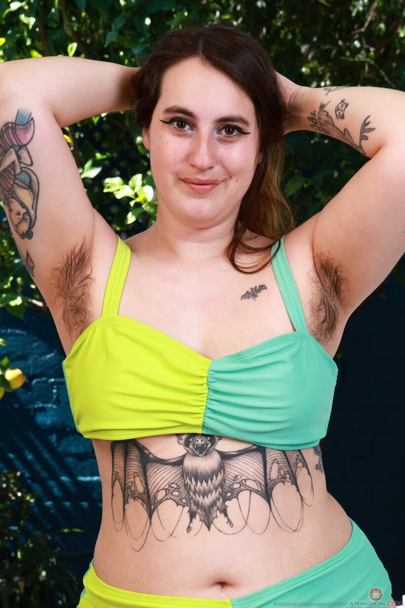 Curvy girl in a swimsuit shows her hairy pussy, photo 1 of 21