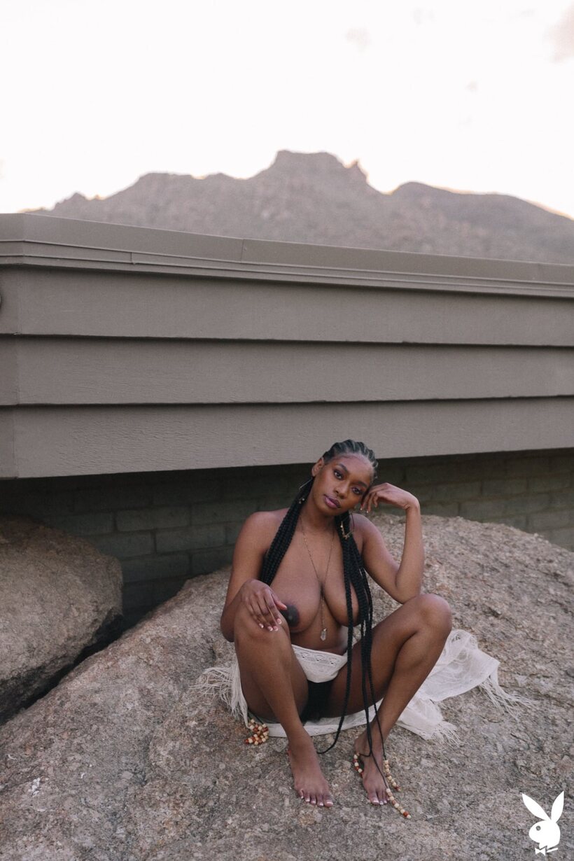 Ebony girl undresses and shows her big tits and hairy pussy outdoors (shot 10)