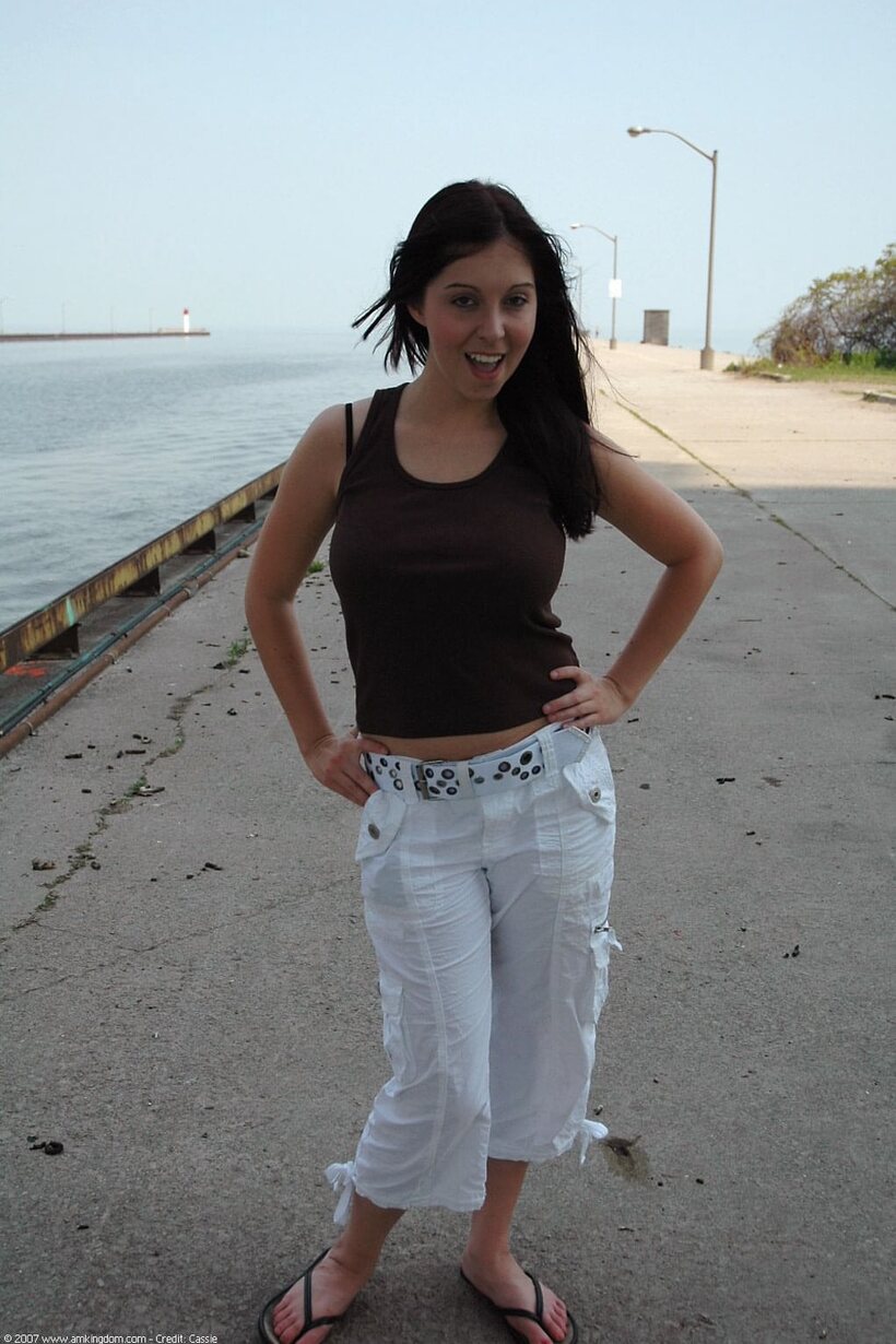 Barefoot by the water, young amateur shows off her pussy and tits, photo 1 of 21