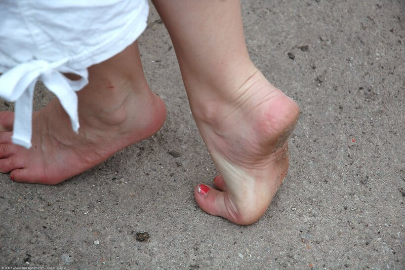 Barefoot by the water, young amateur shows off her pussy and tits (shot 6)