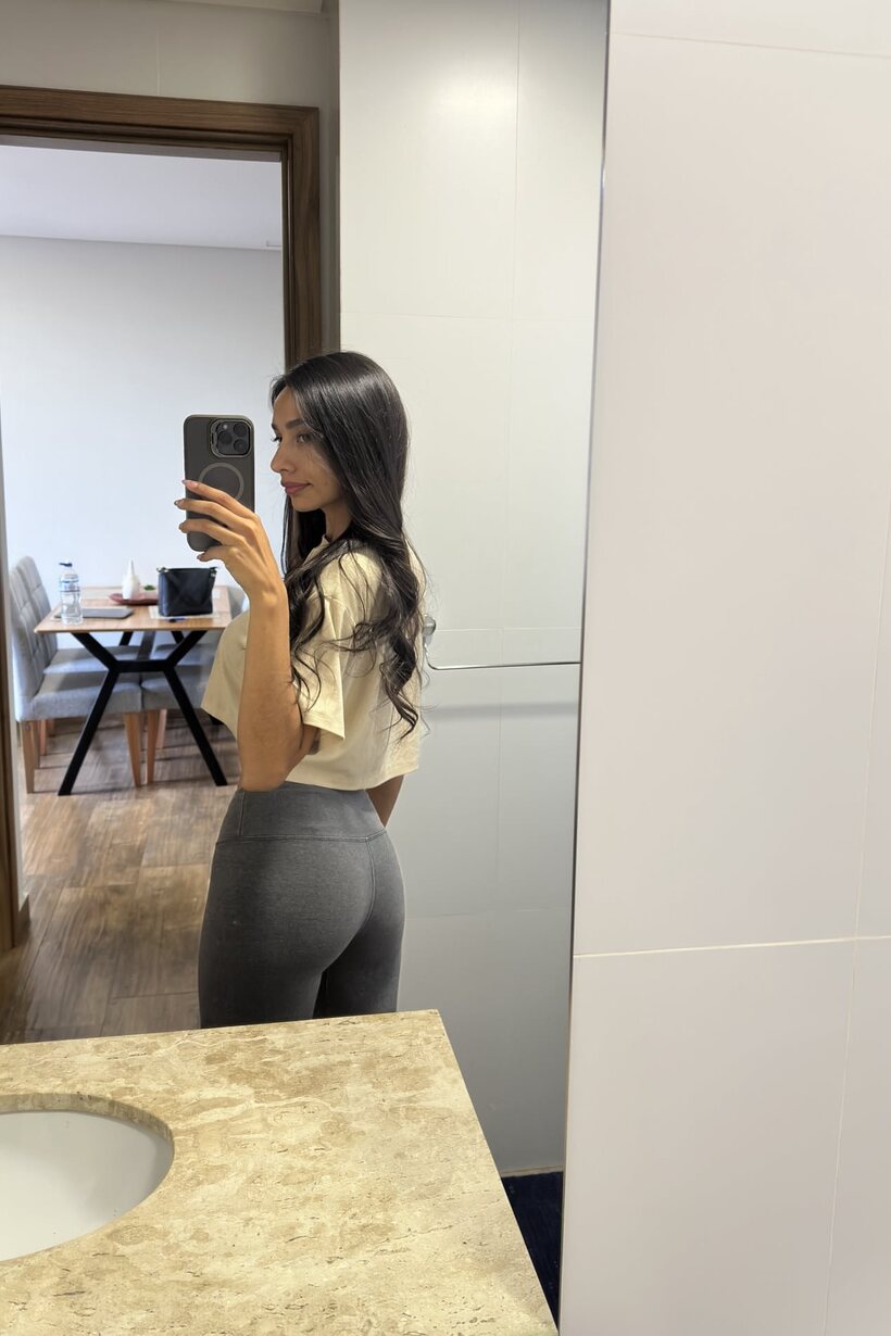 Skinny girl takes selfies and shows her ass in front of the mirror (shot 12)