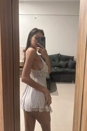 Skinny girl takes selfies and shows her ass in front of the mirror