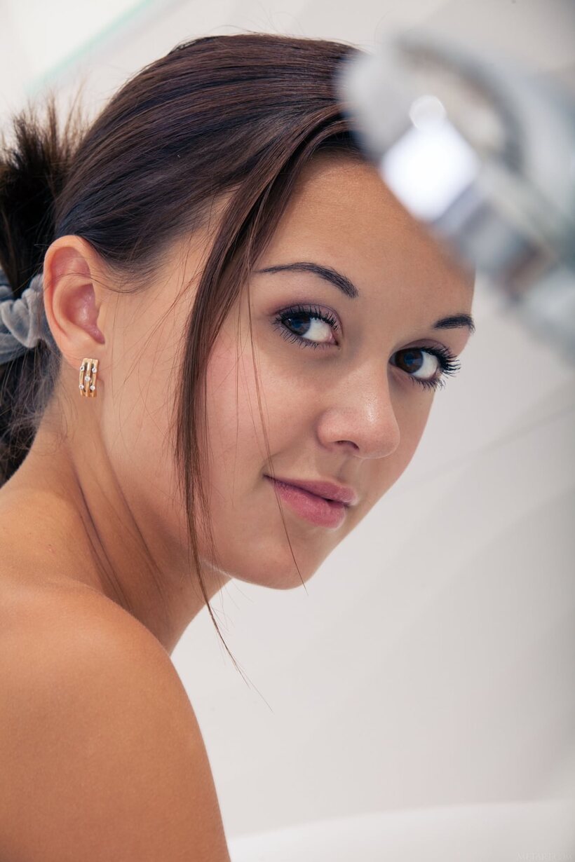 Photo 8 — Veselin peels off her bathrobe before slipping into the bath