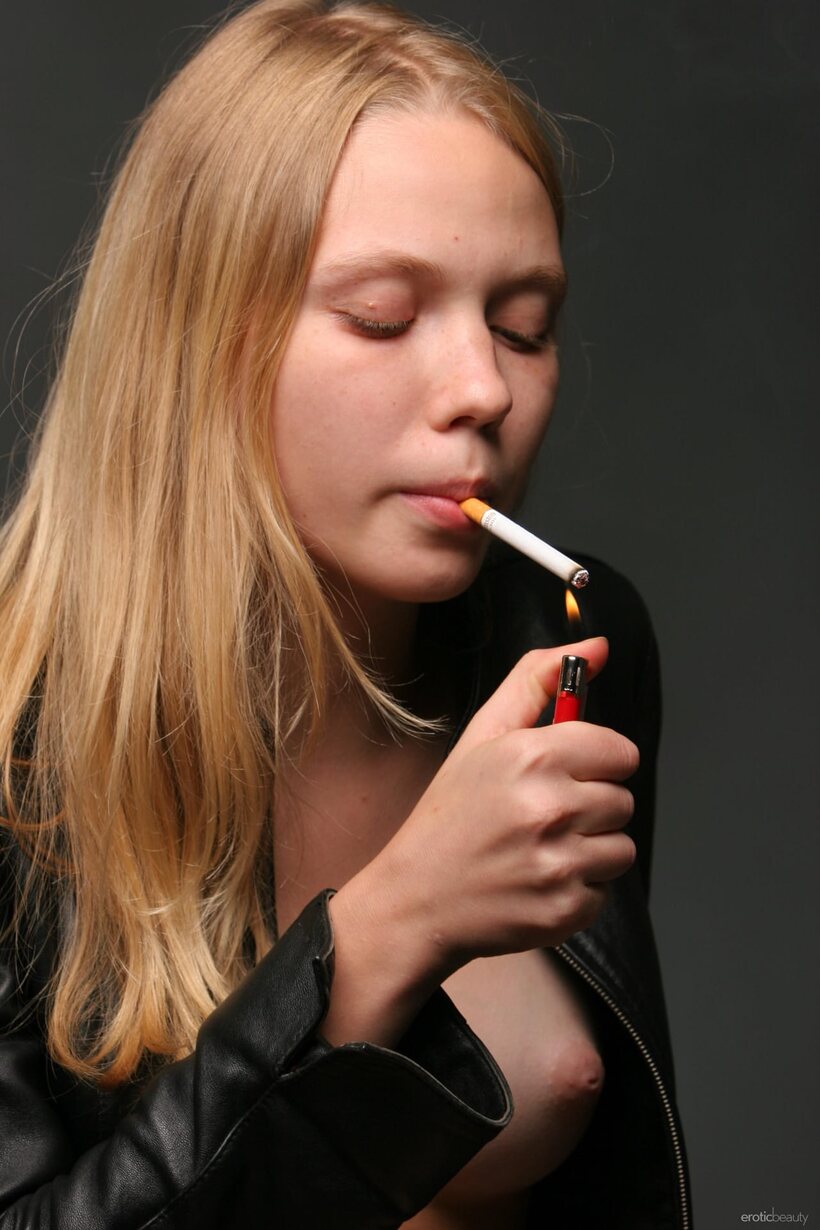 Smoking in jeans, Polly A flashes her tits and shaved pussy (shot 6)