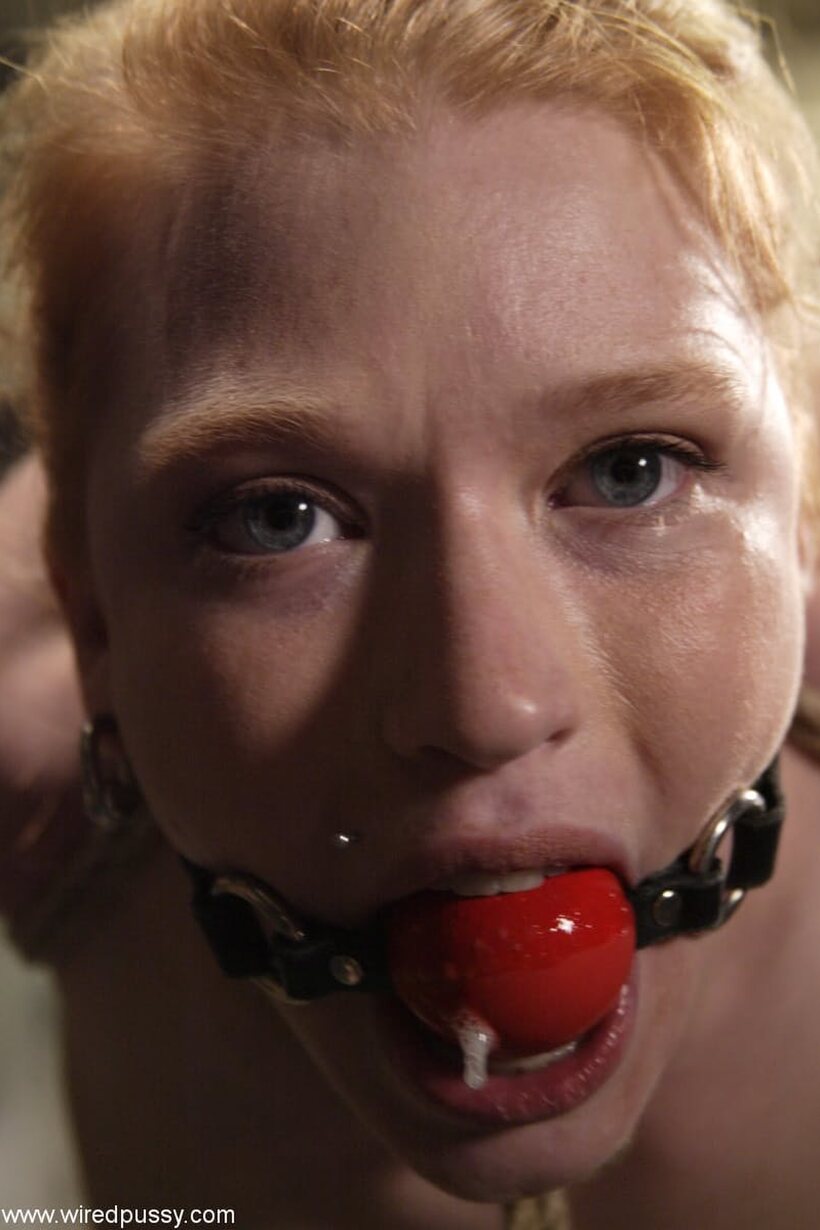 Madison Young wears a red gag while Princess Donna fingers her, photo 2 of 21