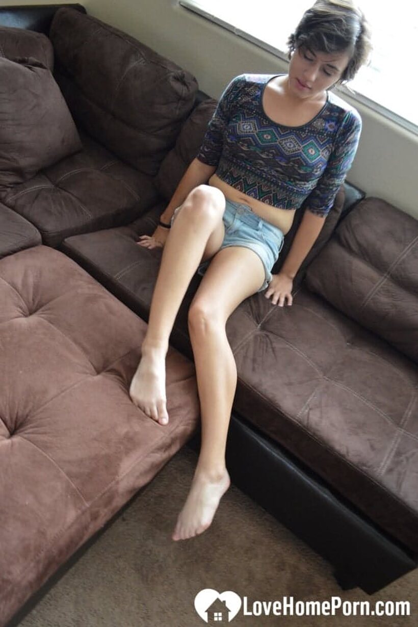 Photo 1 — Pretty girl exposes her tiny tits while playing with a dildo