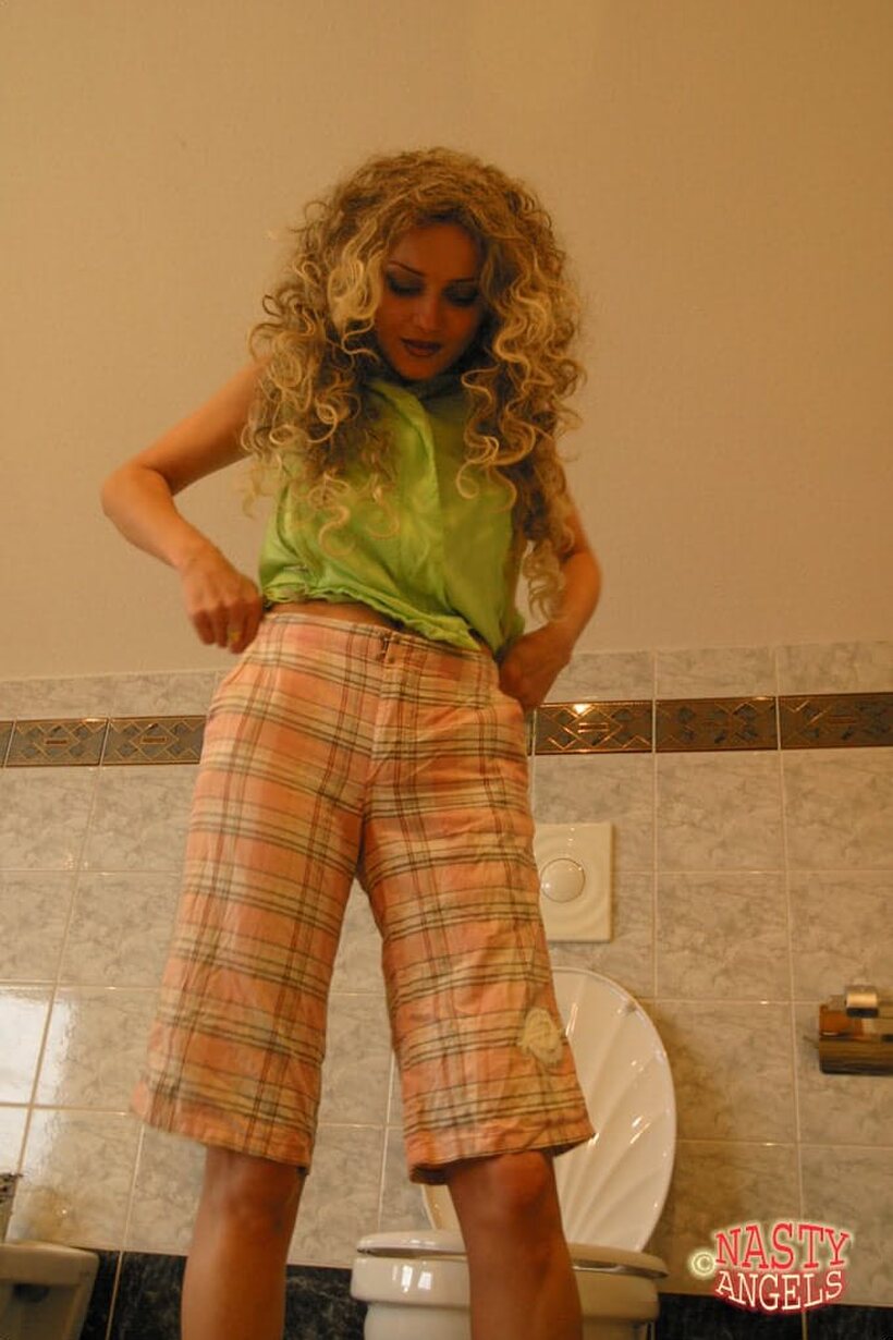Curly-haired blonde teen Sonya strips down and pisses in the bathroom, photo 21 of 21