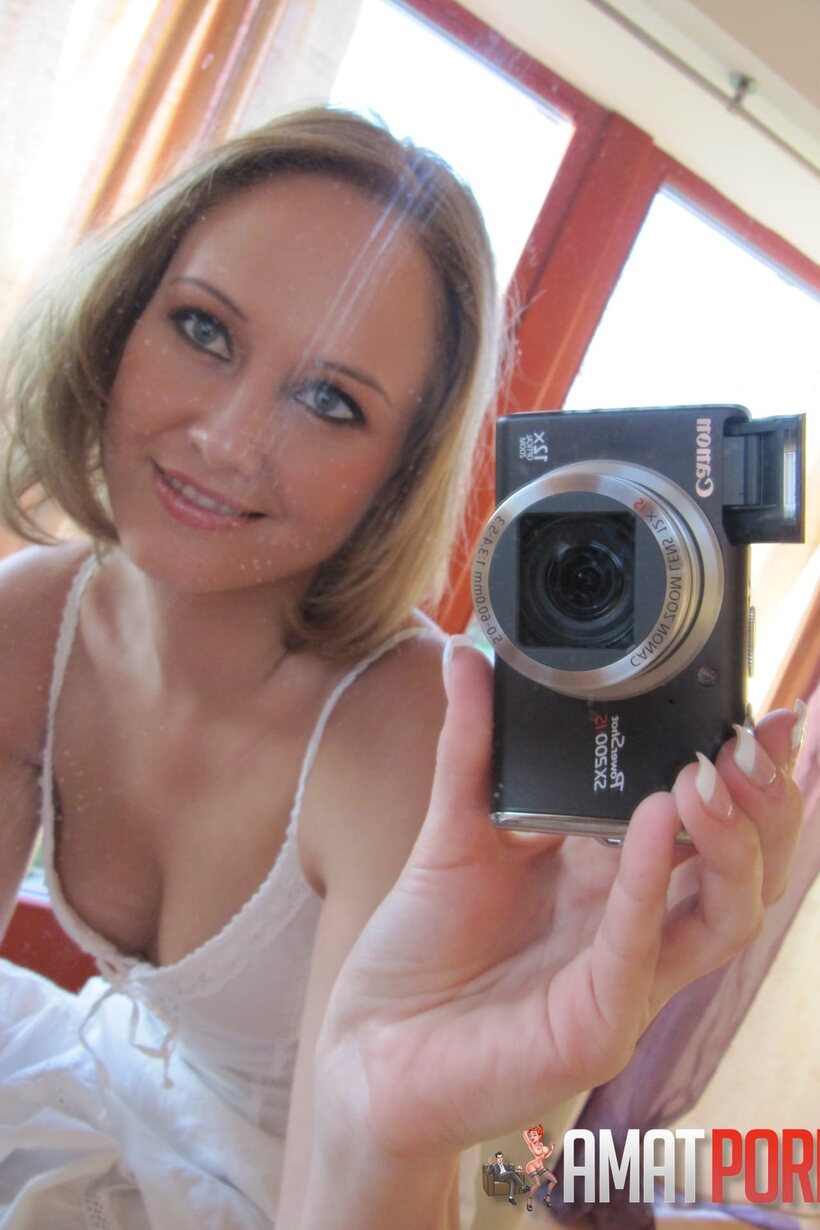 Amateur nude photo 4 — Mirror selfie shows a petite teen baring her big tits