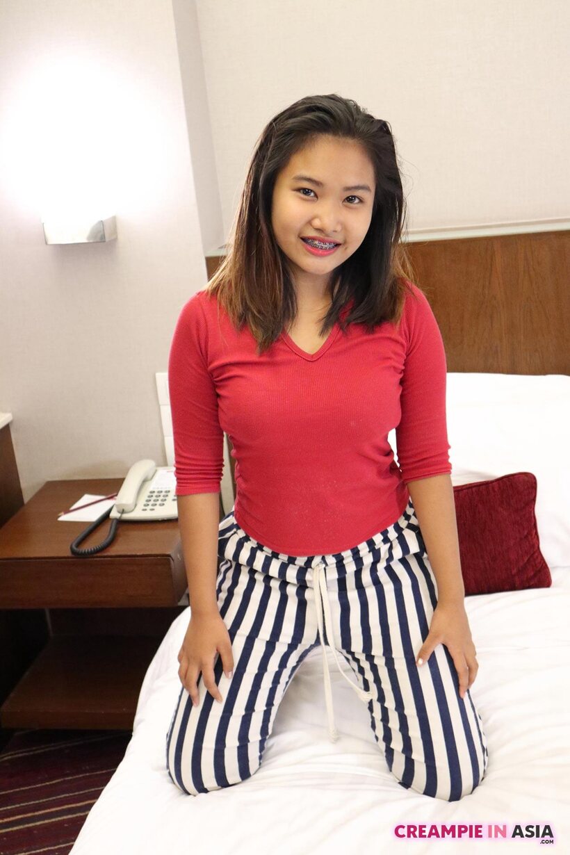 Photo 3 — Brunette girl gets naked in a hotel room and shows her tiny tits