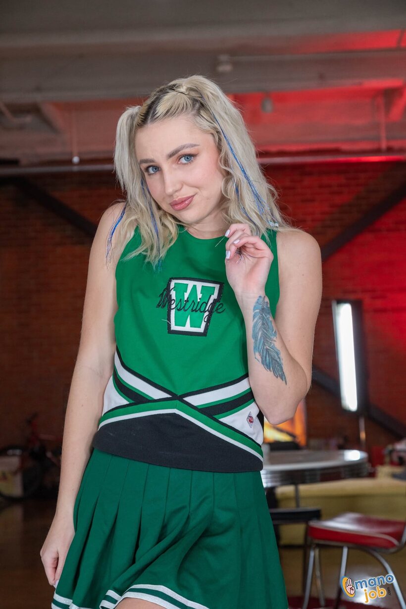 Photo 3 — Britt Blair undresses her cheer uniform for a POV handjob