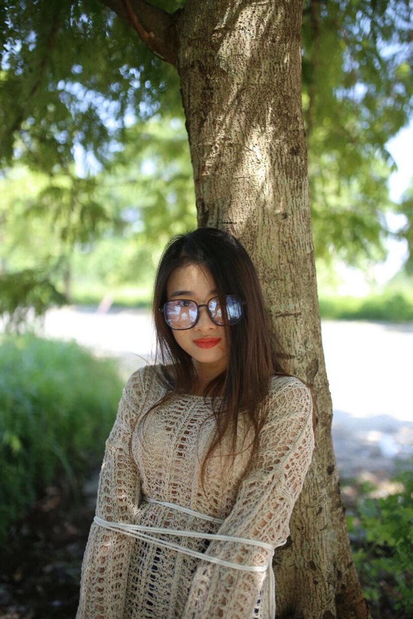 Amateur nude photo 1 — Posing in a cute outfit outdoors, Elena shows off her glasses and Asian charm