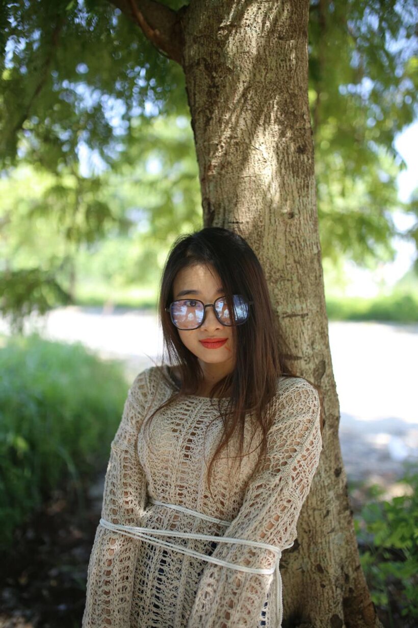 Photo 2 — Posing in a cute outfit outdoors, Elena shows off her glasses and Asian charm