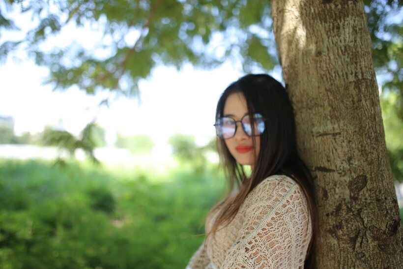 Photo 9 — Posing in a cute outfit outdoors, Elena shows off her glasses and Asian charm