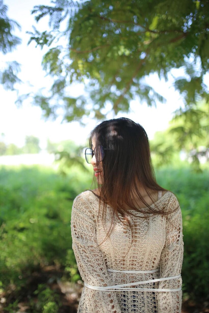 Photo 16 — Posing in a cute outfit outdoors, Elena shows off her glasses and Asian charm