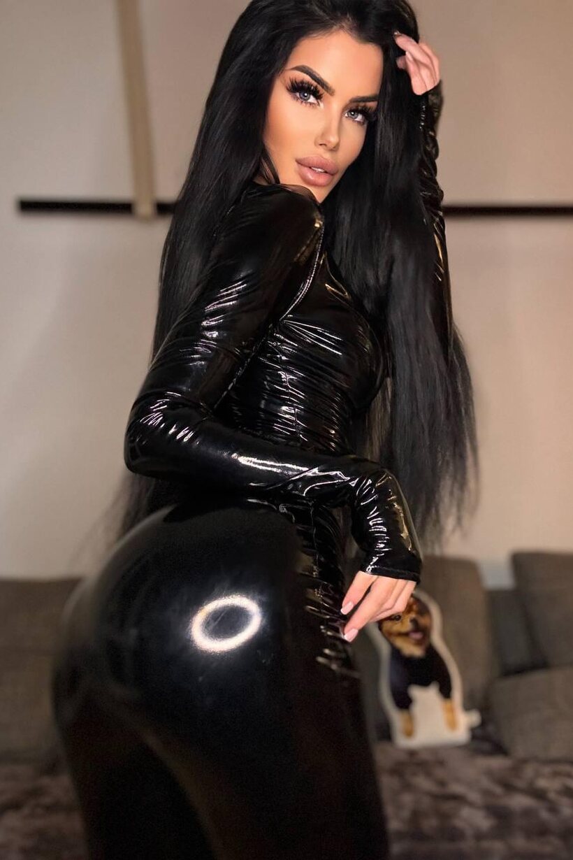 Image 3/10: Sophia 69 slips out of her latex suit and frees her tits
