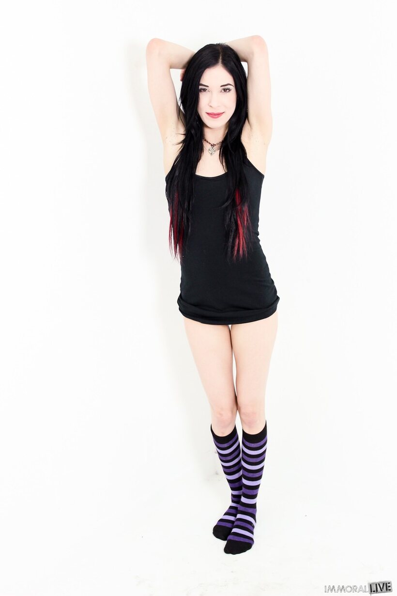 Photo 2 — Aiden Ashley shows off her tiny ass in striped socks and skirt