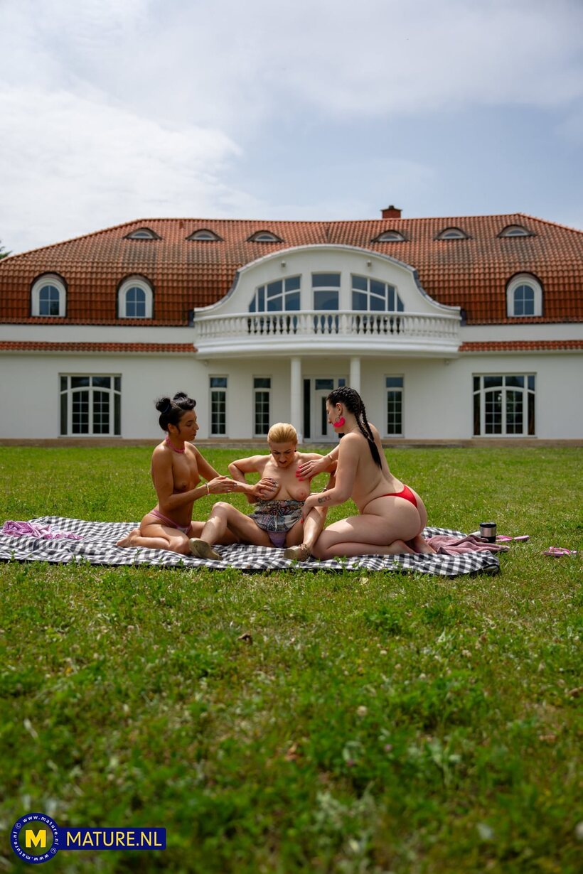Image 12/21: Emily Devine enjoys outdoor fun with a lesbian pair