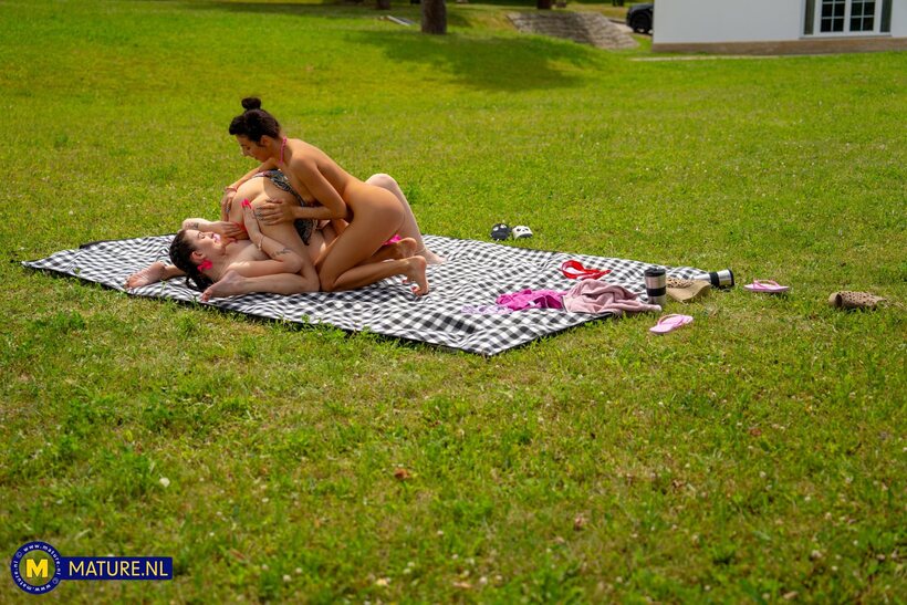 Photo 17 — Emily Devine enjoys outdoor fun with a lesbian pair