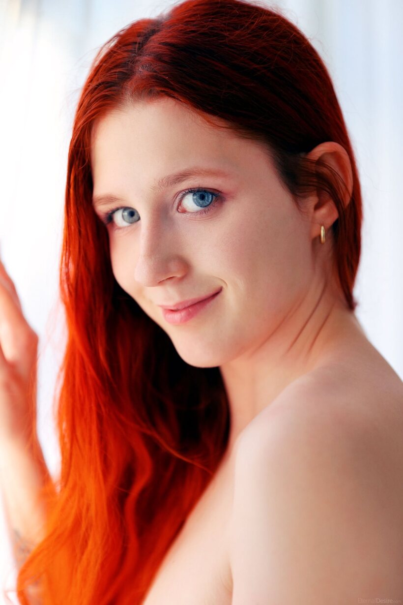 Photo 5 — Bare naked redhead reveals her sweet pussy in solo glamour