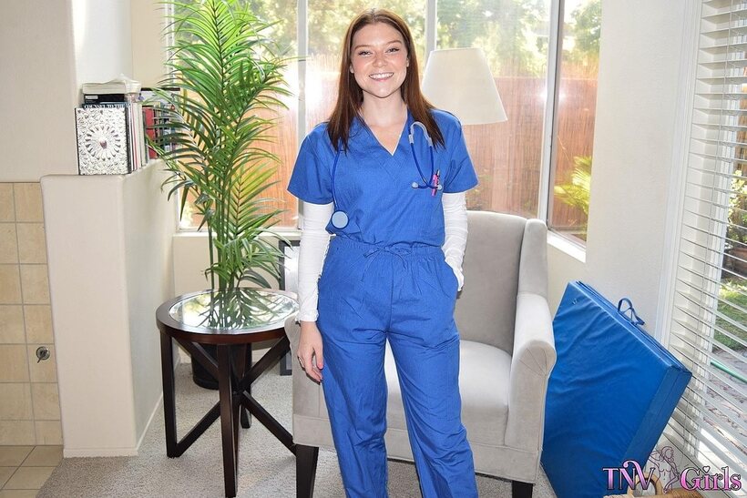 Photo 1 — Katerina strips out of her nurse uniform and poses nude at work