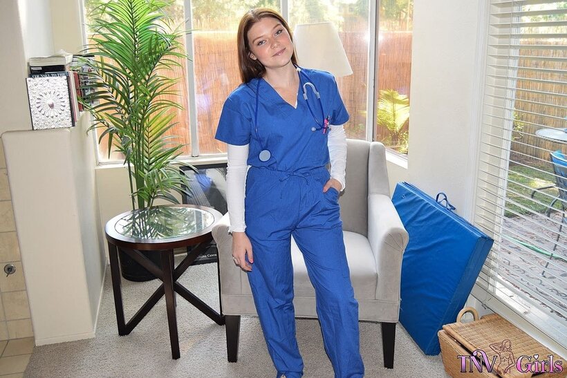 Photo 3 — Katerina strips out of her nurse uniform and poses nude at work